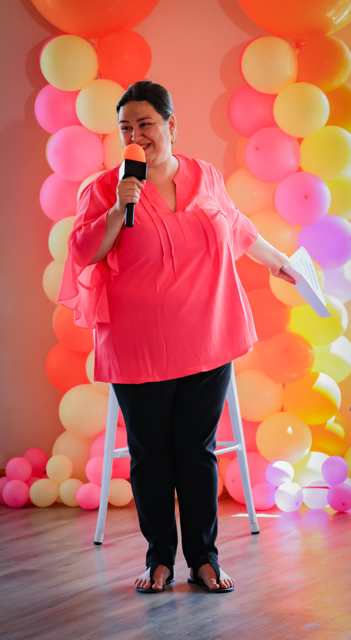 Nicky Cuesta speaking on stage
